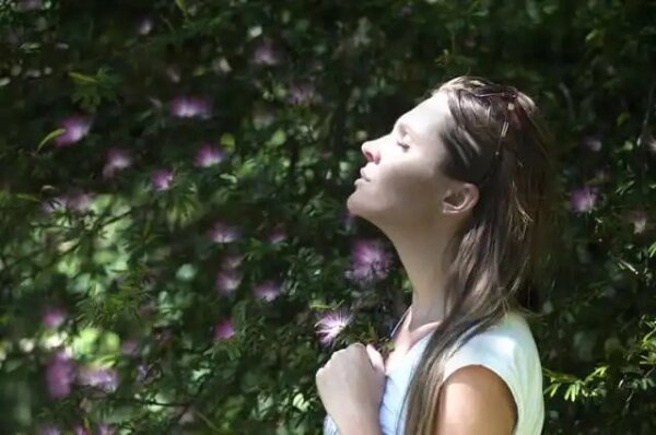 A woman practicing breathing exercises.