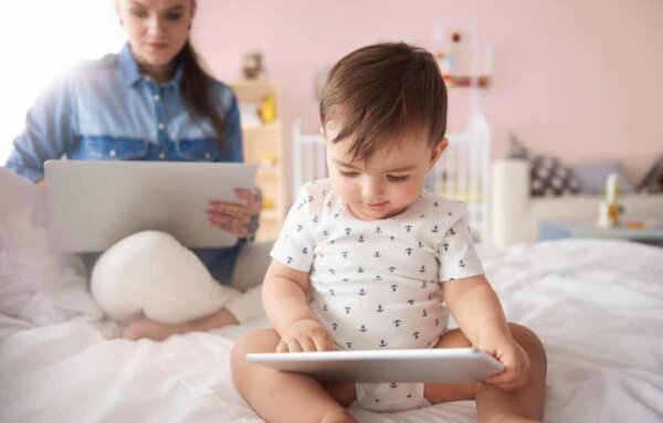 A baby using a tablet.