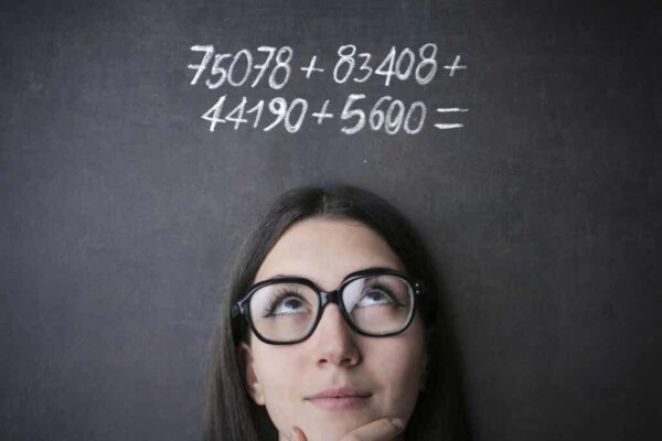 A woman doing math.