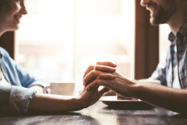 Two people holding hands.