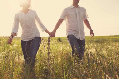 A couple holding hands.