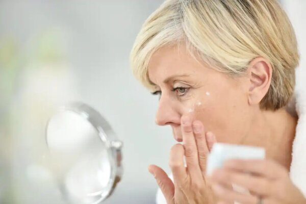 A woman perhaps applying a neurocosmetic cream.