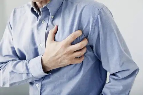 A man clutching his chest.
