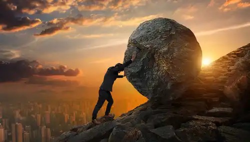 A man rolling a boulder uphill, signifying omnipotence.