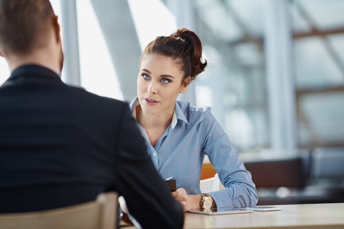 A man and woman in a job interview.