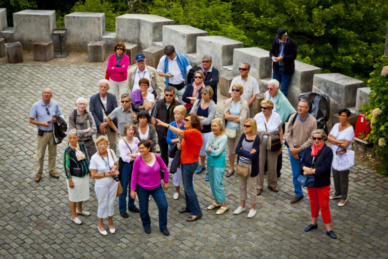 A group of older adults socializing outdoors.