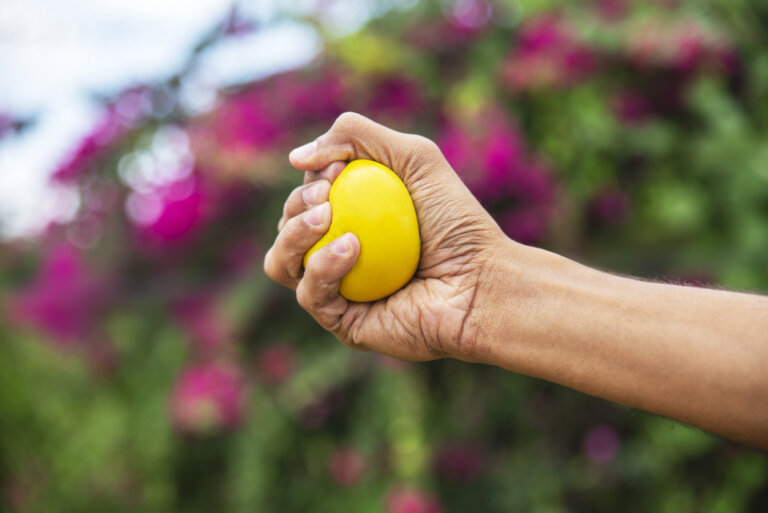 A hand squeezing a stressball.